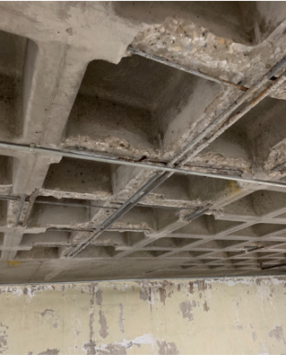 concrete ceiling with water damage